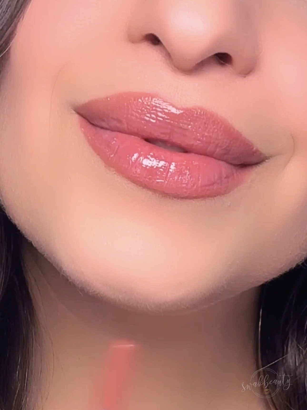 Finished soft neutral glossy lip look with Mauve Blush Liner and Rose Water Lip Oil